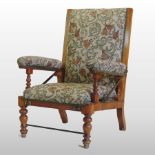 A Victorian walnut and floral upholstere