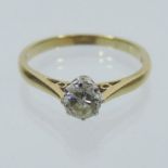 An 18 carat gold solitaire diamond ring,