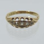 An 18 carat gold diamond five stone ring