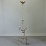 A 19th century gilt brass standing metam