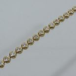 An 18 carat gold and diamond tennis brac