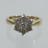 An 18 carat gold seven stone diamond clu