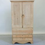 A Victorian pine cabinet, with drawers b