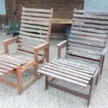 A pair of hardwood steamer chairs