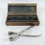 A 20th century cattle tattooing kit, wit