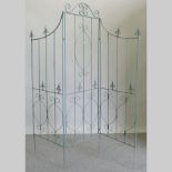 A blue painted metal three fold screen,