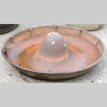 A cast iron circular pig trough, 85cm di