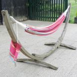 A hardwood garden hammock, 330cm overall