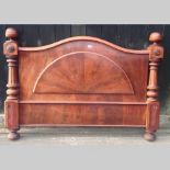A Victorian carved mahogany double bedst