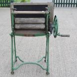 A green painted cast iron mangle, 86cm o