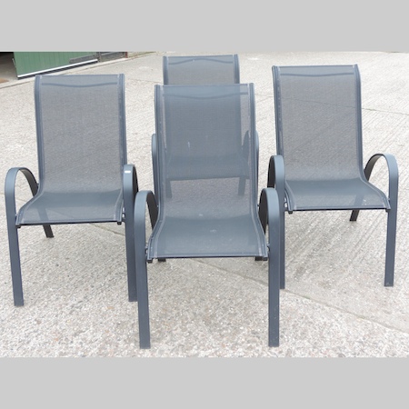 A set of four black canvas garden chairs