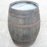 A coopered wooden iron bound barrel, 95c