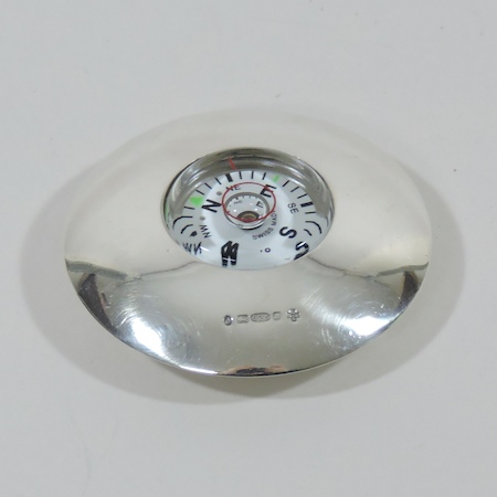 An Asprey silver mounted pocket compass,
