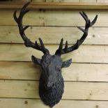 A bronzed head of a stag, 82cm tall