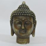 A brass Thai buddha head, 15cm tall