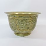 A Chinese brass bowl, with relief decora
