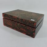 A French lacquered and cut brass jewellery box,