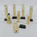 A collection of carved figures, on hardw