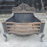 A 20th century cast iron fire grate, 63c