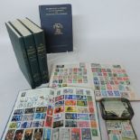 A stamp album, together with another, lo