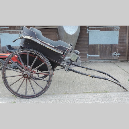 A black painted wooden governess cart,