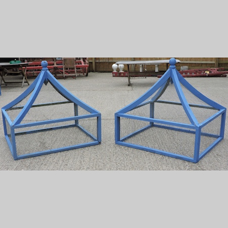 A pair of blue painted wooden garden cloches,