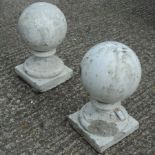 A pair of reconstituted stone and marble garden markers,