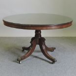 A Regency mahogany and crossbanded circular dining table,