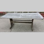 A teak rectangular garden table,