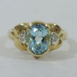 An 18 carat gold aquamarine and diamond ring,