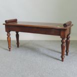 A mahogany window seat, on turned legs,