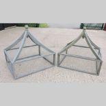 A pair of grey painted wooden garden cloches,