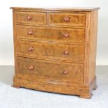 A Frank Hudson Ltd oak and walnut bow front chest of drawers,