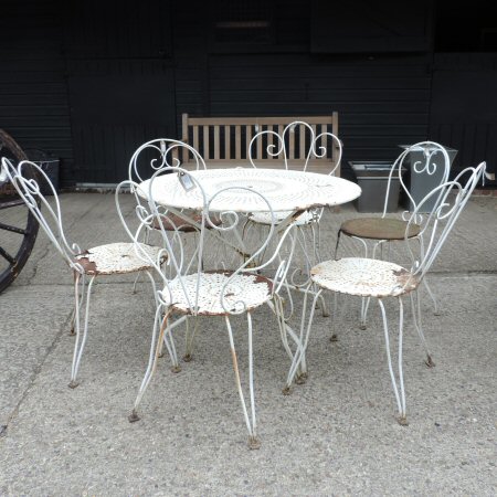 A white painted metal circular garden table, 96cm diameter,