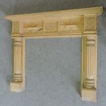 A modern carved stained pine fire surround,