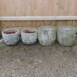 A pair of reconstituted stone garden pots, 30cm,