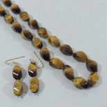 A 9 carat gold tigers eye necklace and earrings set,