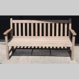 A hardwood slatted garden bench,