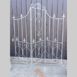 A blue painted metal three fold screen,