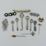 A stock pin, in the form of a hare, together with two others, silver and costume jewellery brooches,