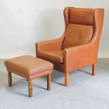 A Morgensen style brown upholstered high back armchair,