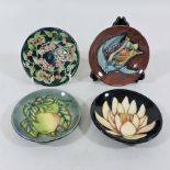 A collection of four Moorcroft pottery dishes,