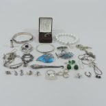 A collection of mainly silver costume jewellery, to include bangles,