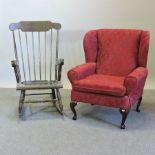 A modern red upholstered wing back armchair,