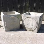 A pair of reconstituted stone garden planters,