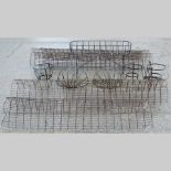 A collection of cloches, together with metal garden plant holders,