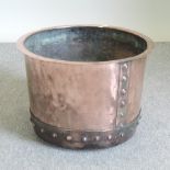 A 19th century copper, of circular riveted shape, impressed 10,