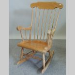 A 20th century pine rocking chair