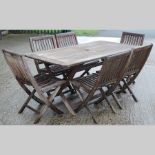 A hardwood folding garden table, 160 x 90cm, together with six folding chairs,