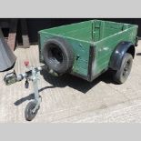 A green painted wooden box car trailer,
